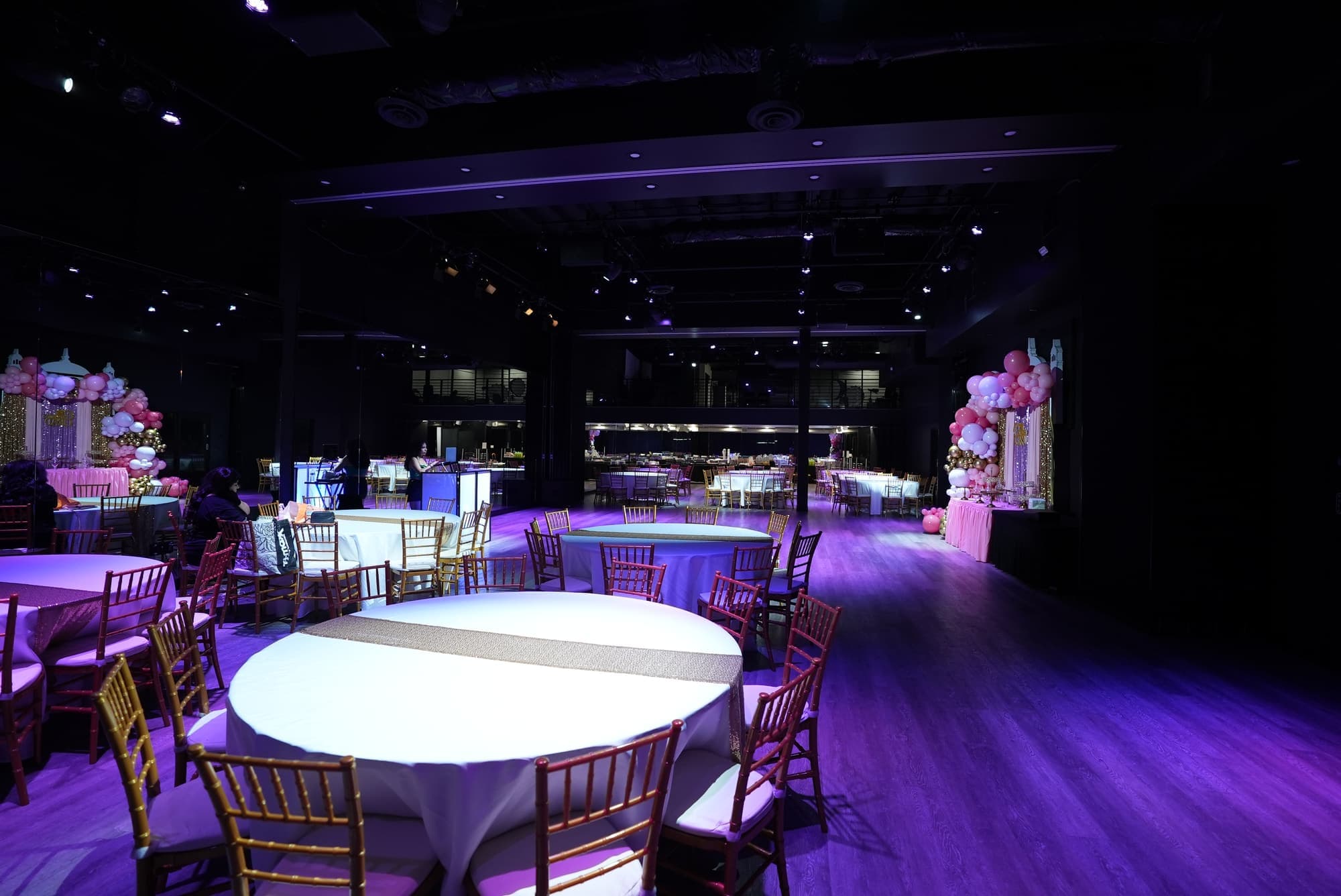 An open floor between the tables, ready for dancing