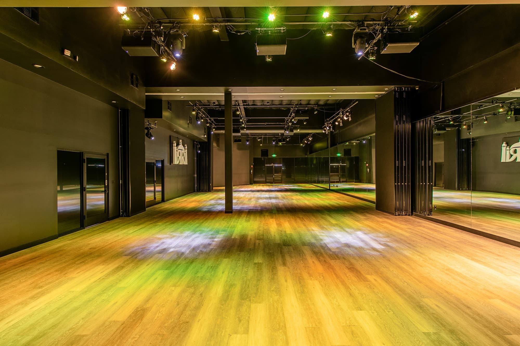 The main hall with its mirrored back wall and warm stage lights
